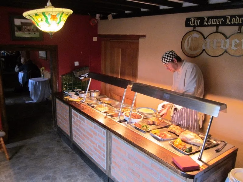The Lower Lode carvery counter prepared with roast meats and serving dishes.