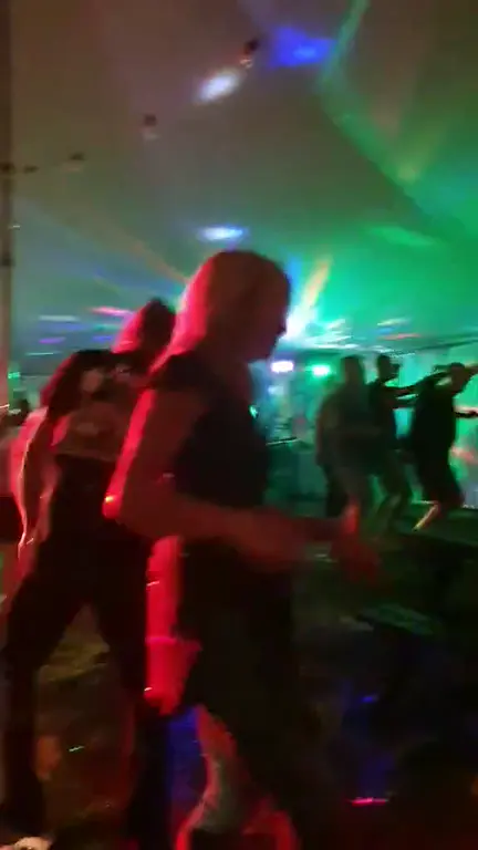 Visitors dancing under colourful lights inside the festival marquee at the 2025 Lower Lode Inn Oktoberfest.